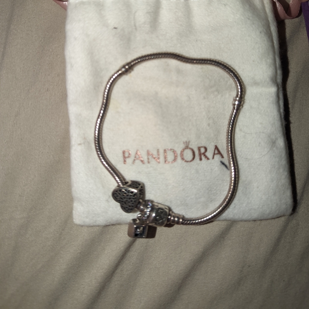 Pandora bracelet plus 2 charms